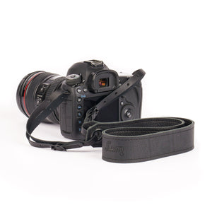 soft black leather camera strap on Canon camera with black leather end straps and black grommets