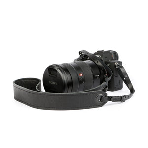 soft black leather camera strap on Sony camera with black leather end straps and black grommets