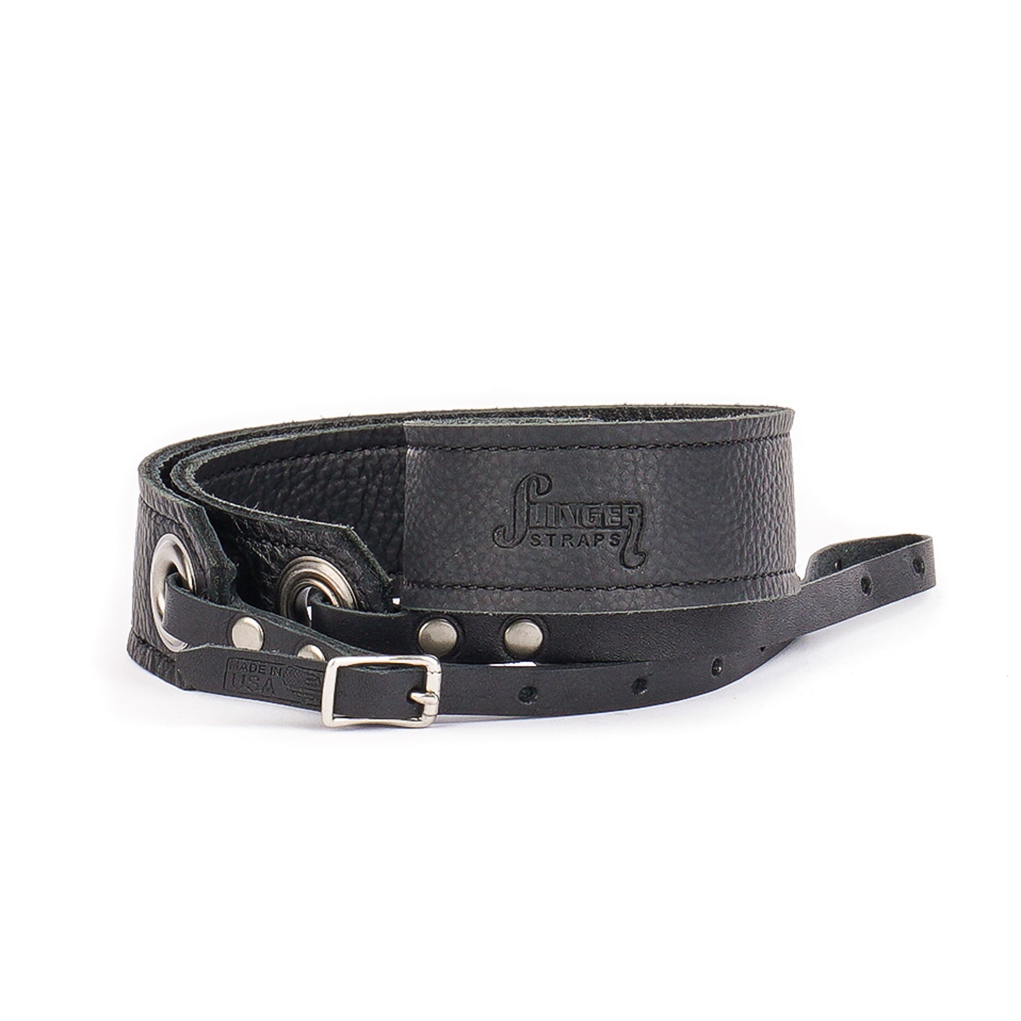 black leather camera strap with brushed nickel grommets rolled on side