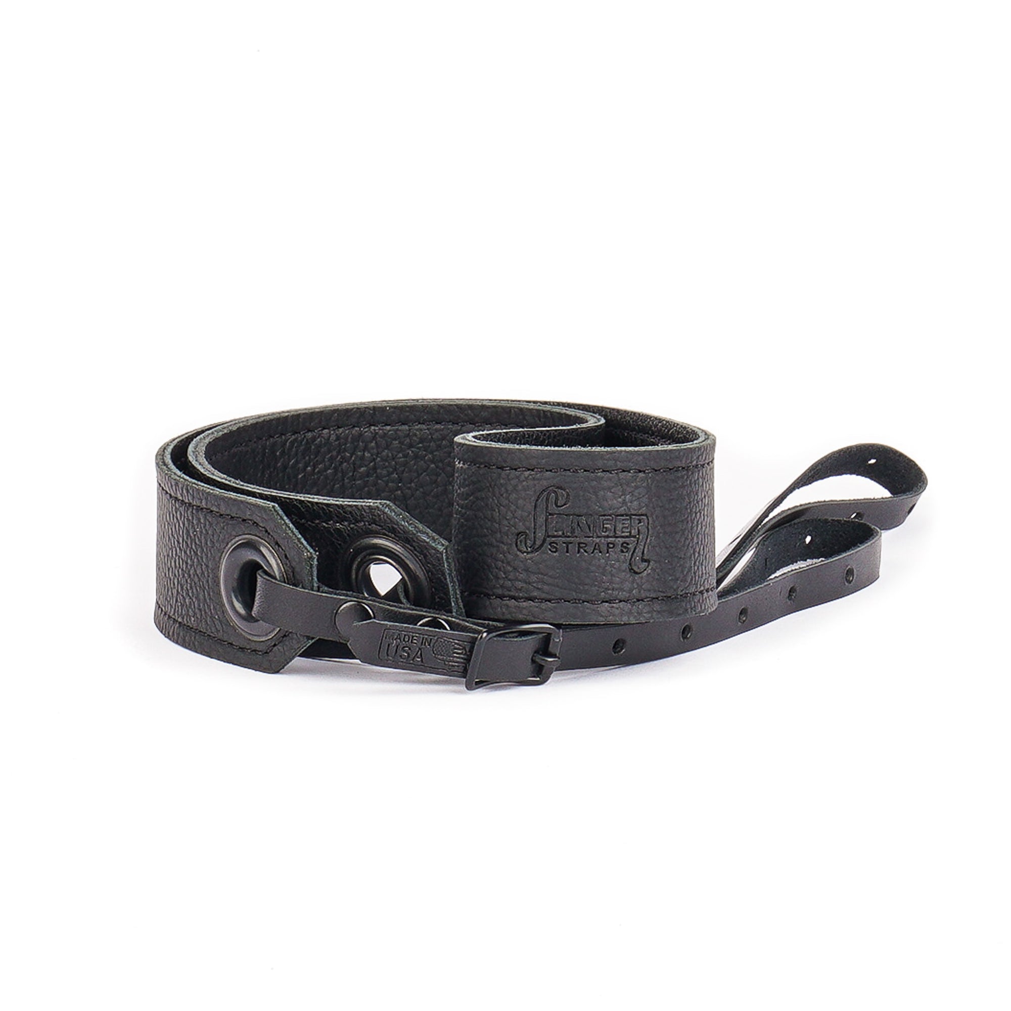black leather camera strap with black grommets rolled on side