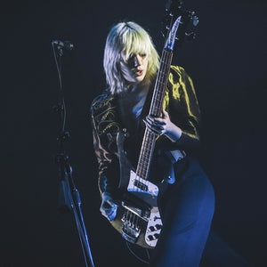 Julia Cumming from Sunflower Bean performing in Seattle with the Hip Strap waist guitar strap.