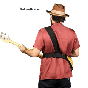 Rear view of Tyler playing bass with a 3 inch sling strap bass strap on left shoulder