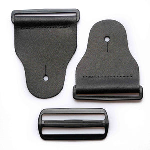 frontside of a 3-inch tapered black leather guitar strap end kit with acetal plastic hardware