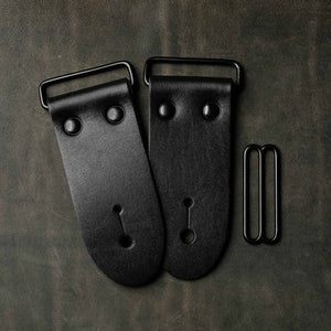 frontside of black leather guitar strap end kit for a guitar strap with black hardware