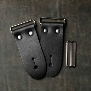 frontside of black leather guitar strap end kit for a guitar strap with nickel hardware
