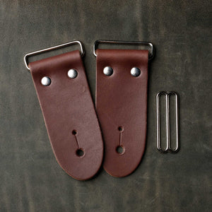 frontside of brown leather strap end kit for a guitar strap with nickel hardware