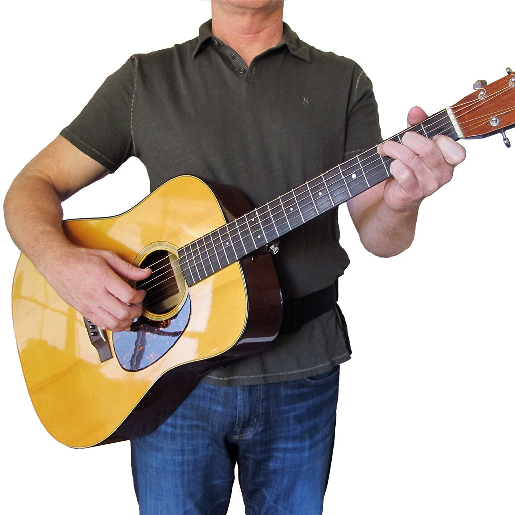 man wearing acoustic hip strap guitar strap