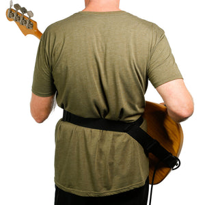 backside of player wearing a hip strap guitar strap with a fender jazz bass worn higher on waist
