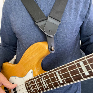 leather shoulder strap adapter that connects two shoulder straps to one attachment piece on a fender jazz bass