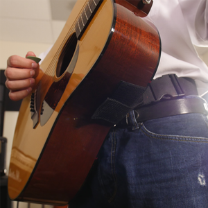 Velcro attachment on acoustic hip strap guitar strap
