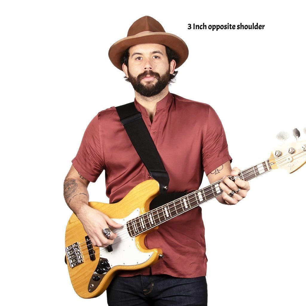 Ty playing bass with a 3 inch sling strap bass strap on right shoulder