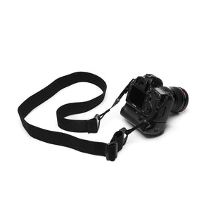 Camera strap made of 2" wide heavy-duty elastic material attached to a Canon camera with battery grip