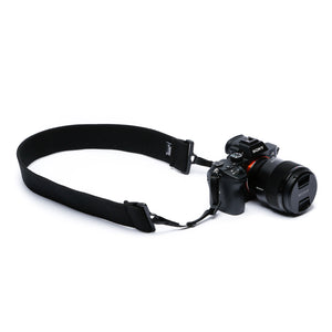 Camera strap made of 2" wide heavy-duty elastic attached to a Sony camera