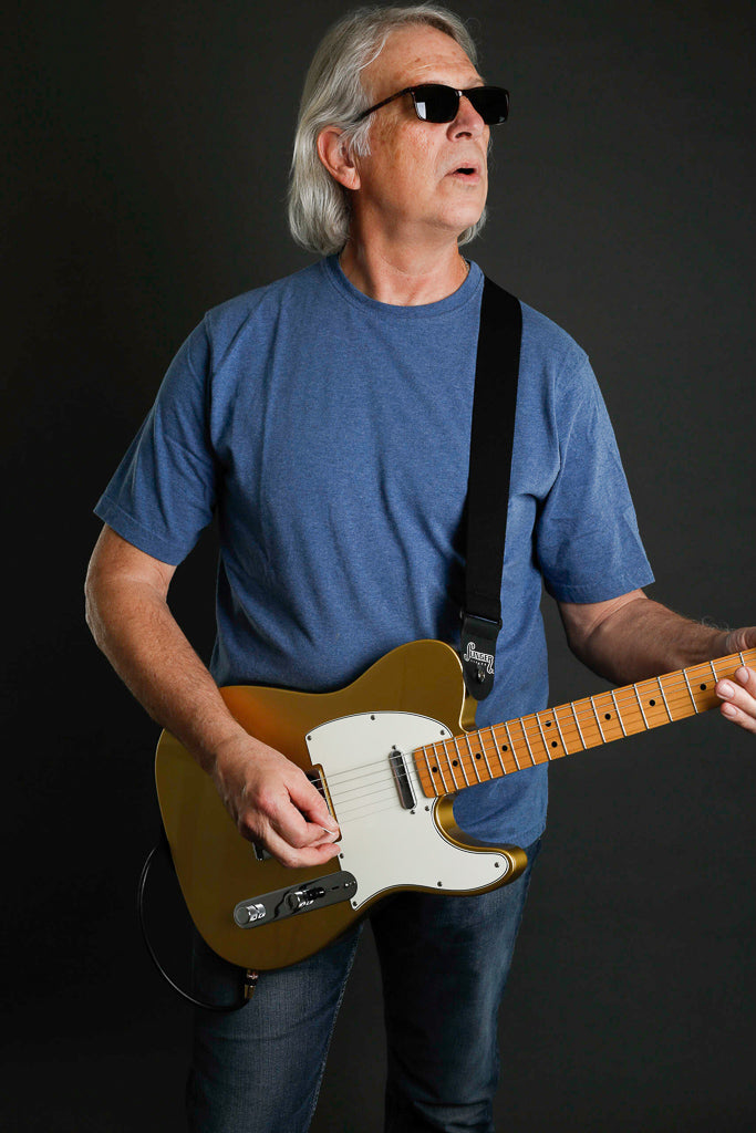 elastic guitar strap from Slinger Straps holding a Fender Telecaster guitar