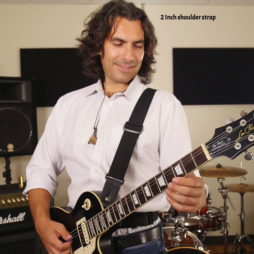 john playing a Les Paul guitar with a sling strap guitar strap on right shoulder