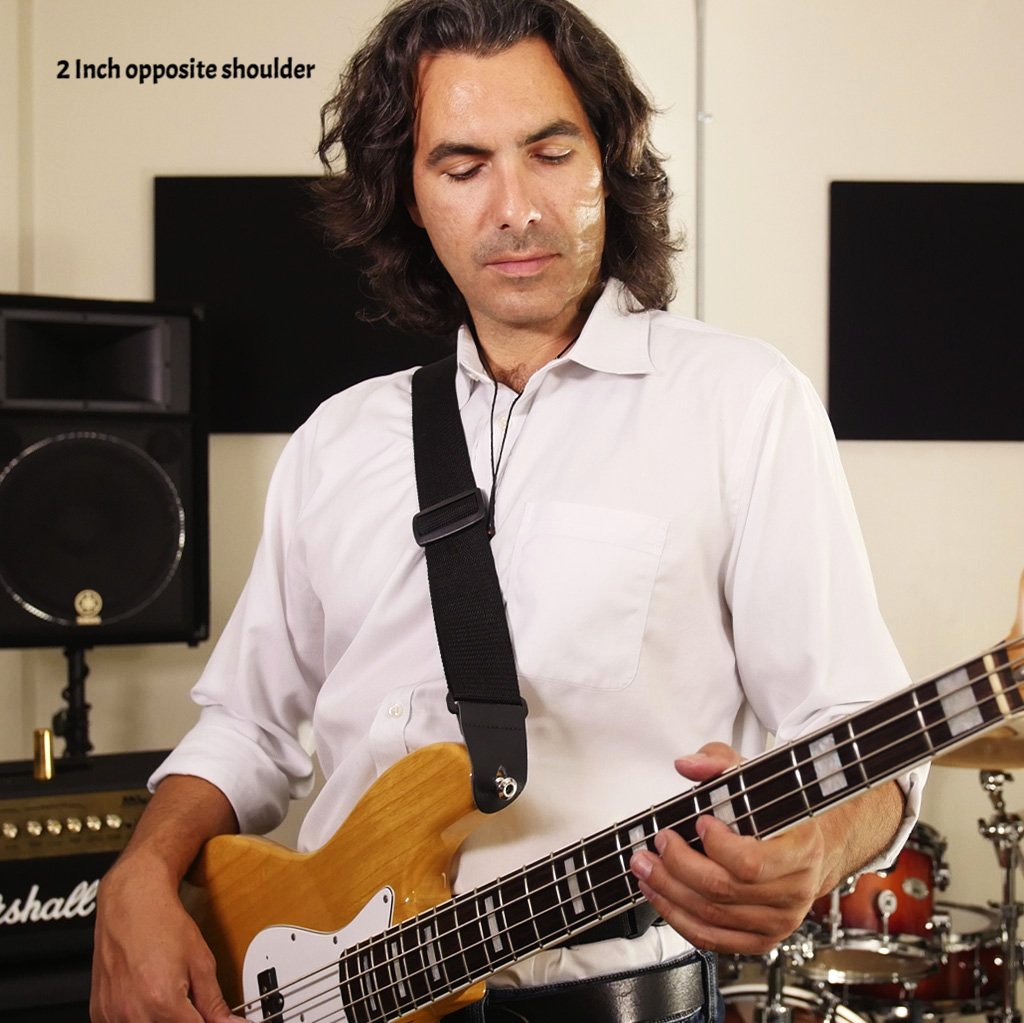 john playing a bass with sling strap guitar strap on right shoulder