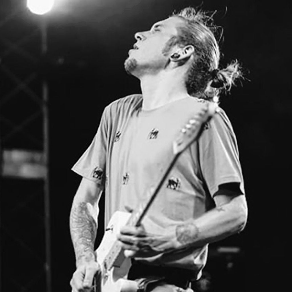 Colbi Childs jamming with the Slinger Hip strap guitar strap