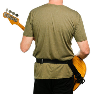 backside of player wearing a hip strap guitar strap with a fender jazz bass
