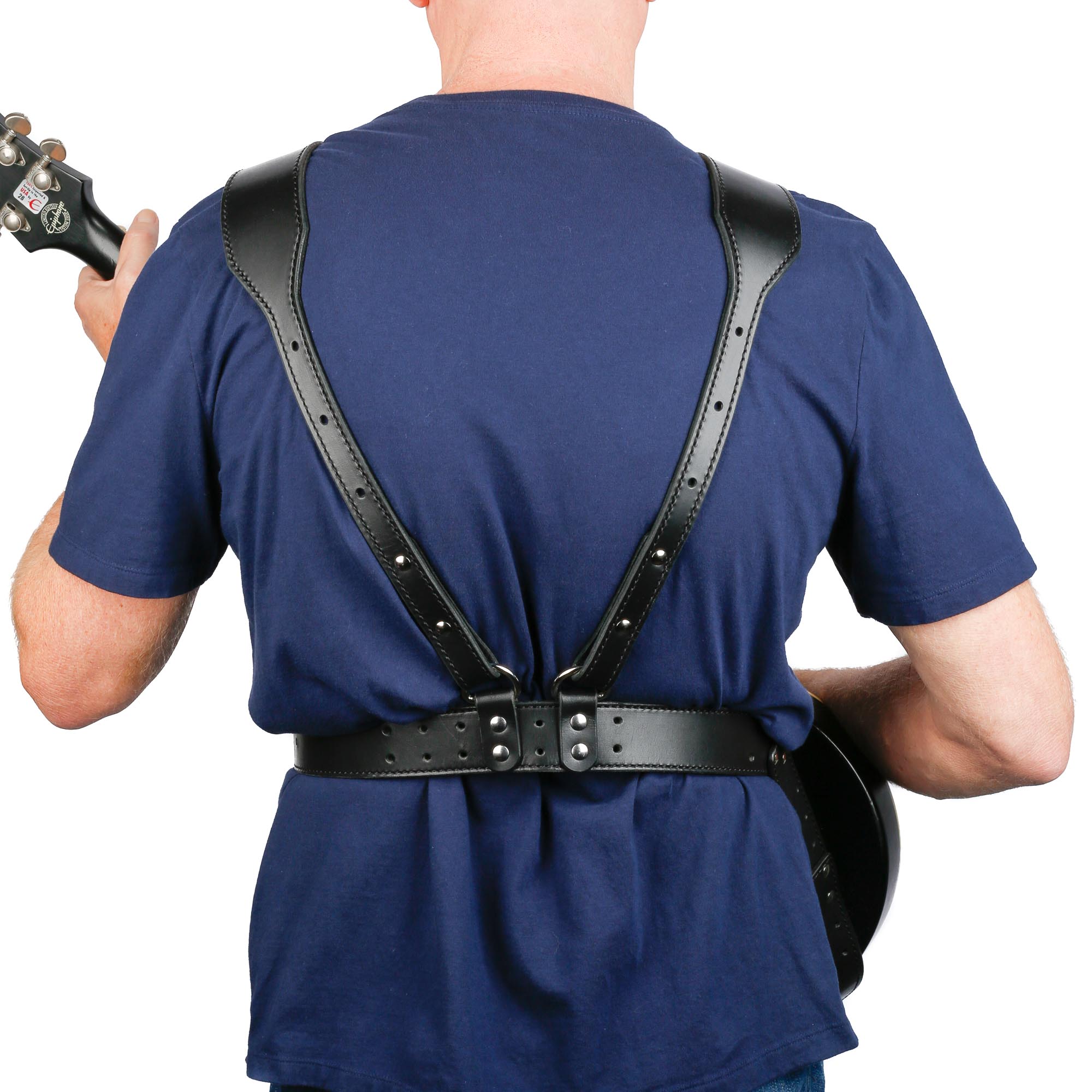 rear view of black leather harness strap with gibson lea paul